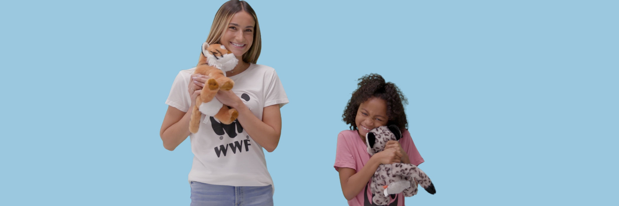 children hold plush animals